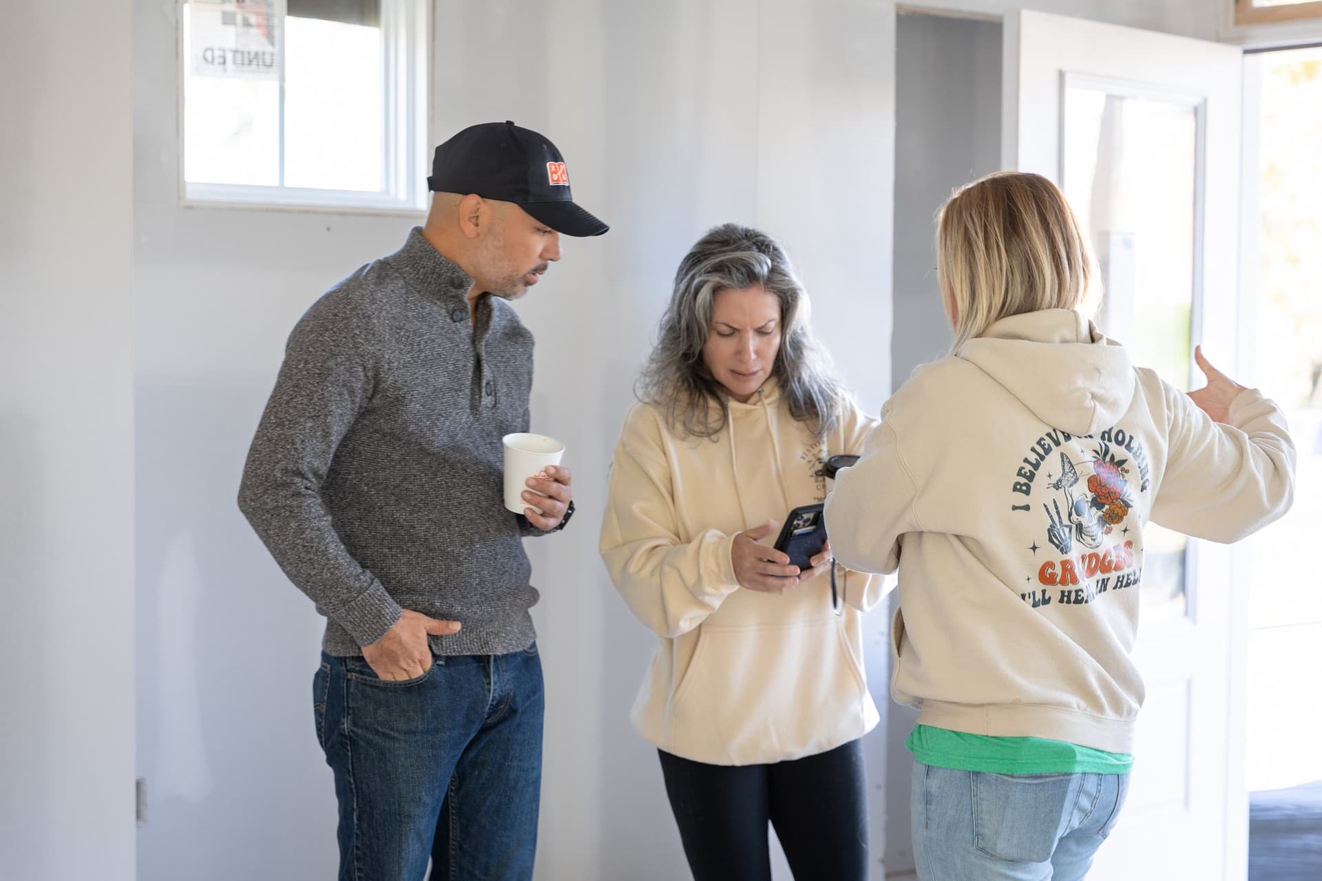 Derek Davis reviewing a property with clients